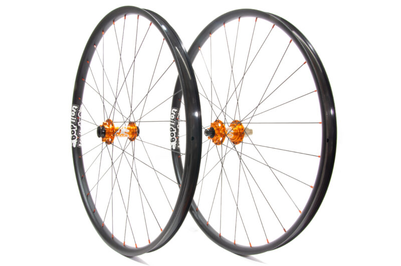 Traildog wheelset with orange boost J-bend hub with laser etched logos