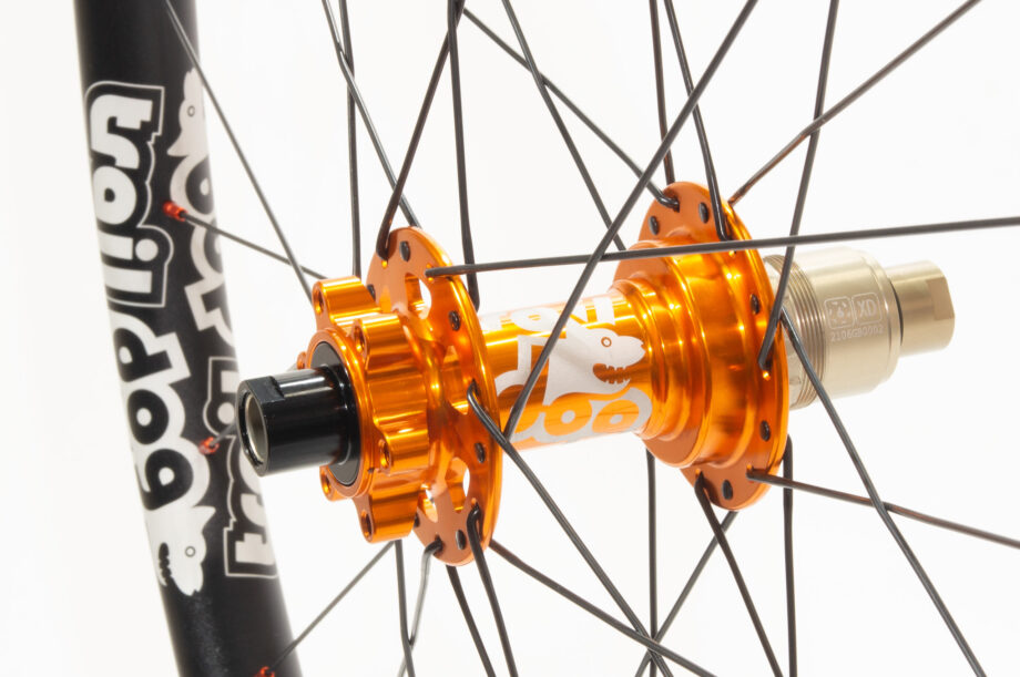 Traildog wheelset with orange boost J-bend hub with laser etched logos