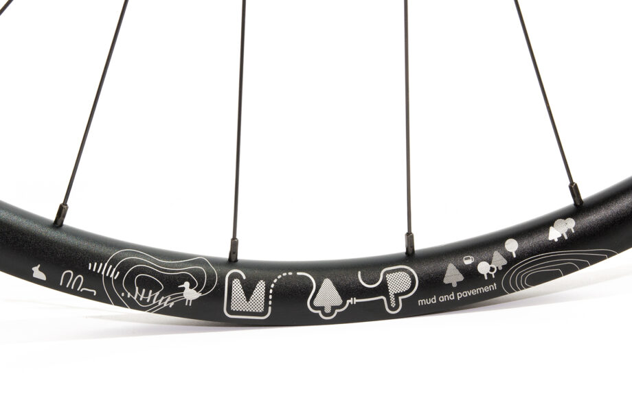Map rim with etched design and black spoke nipples