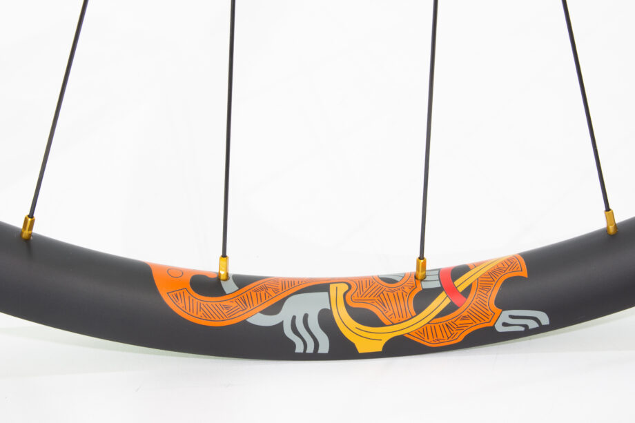 Karve carbon rim with orange water transfer decal and gold nipples