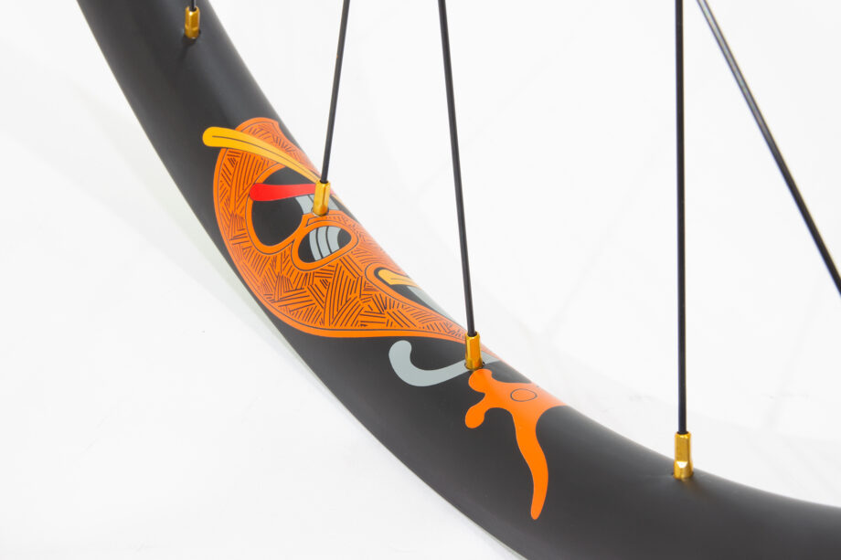 Karve carbon rim with orange water transfer decal and gold nipples