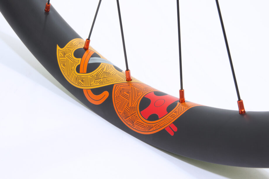 Knarr carbon rim with orange nipples and orange water transfer rim decals