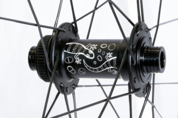 gecko etching on a front centre-lock J-bend hub in matt black